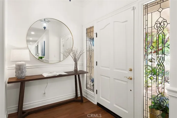 Entry with wide front door and leaded glass side lights