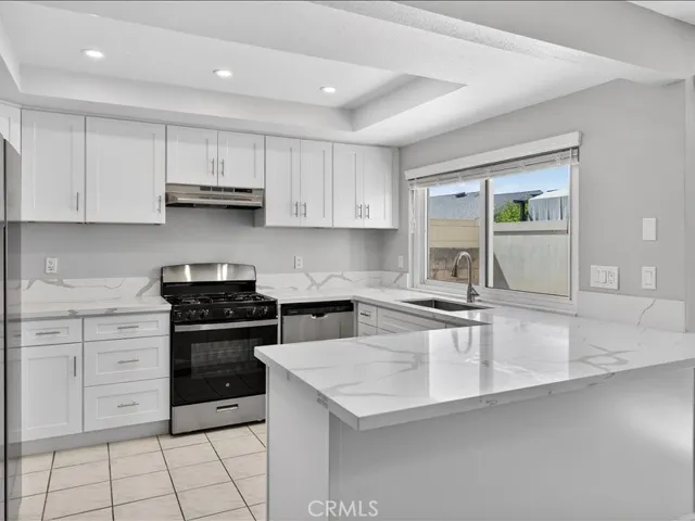 Brand-new kitchen featuring modern cabinetry, sleek finishes, and stainless-steel appliances