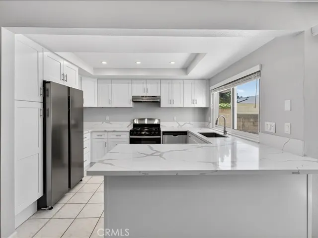 Brand-new kitchen featuring modern cabinetry, sleek finishes, and stainless-steel appliances