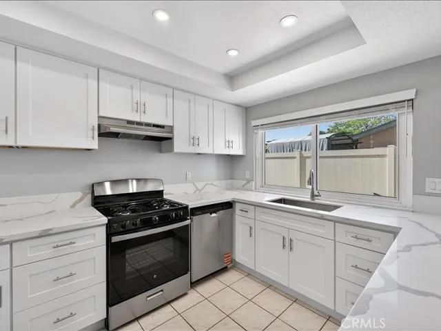 Brand-new kitchen featuring modern cabinetry, sleek finishes, and stainless-steel appliances.