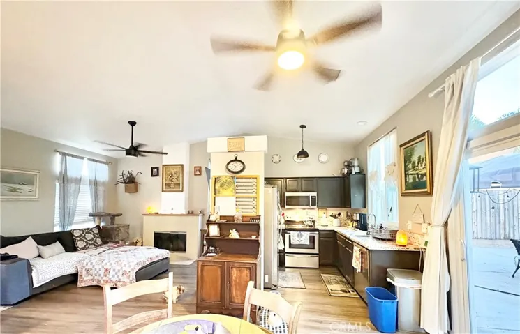 VIEW OF KITCHEN AND LIVING ROOM/SMALL WALL BETWEEN COULD BE REMOVED TO OPEN UP FLOORPLAN