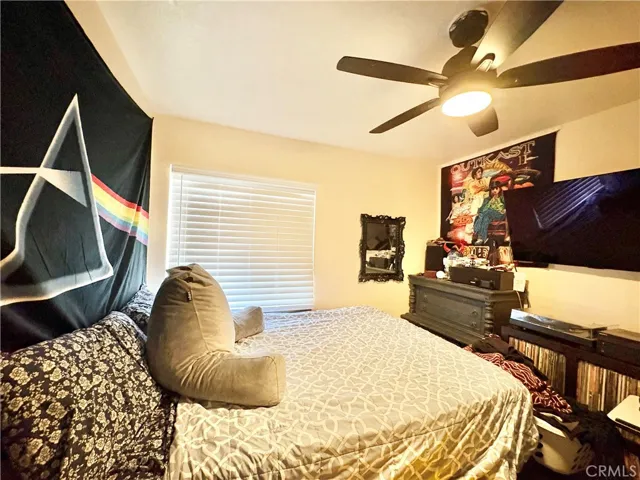 THIRD BEDROOM WITH CEILING FAN AND LAMINATE FLOORS