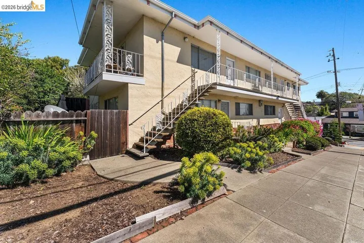 View of apartment building / complex featuring stairs