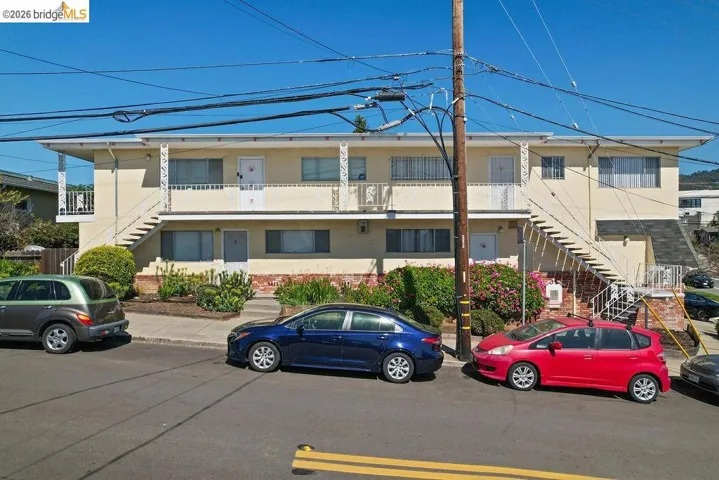 View of property with stairs
