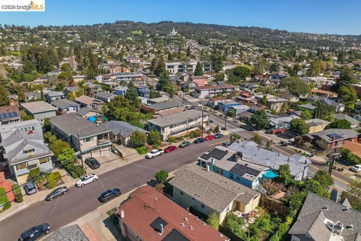 Aerial view of property's location featuring nearby suburban area
