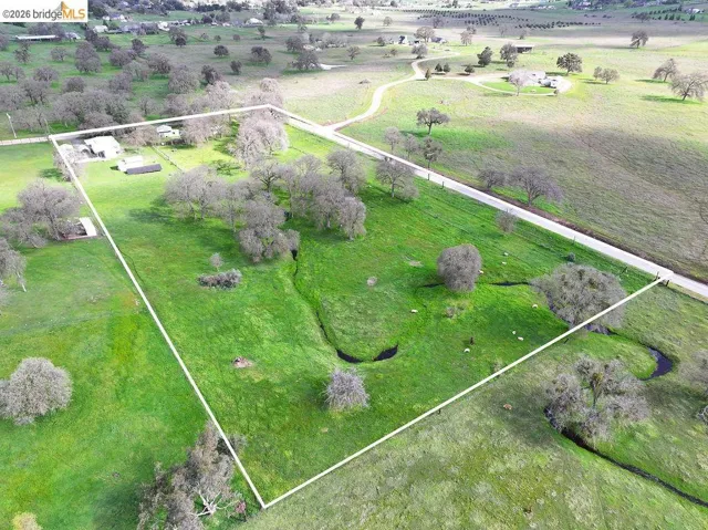 Overview of rural landscape featuring property boundaries highlighted