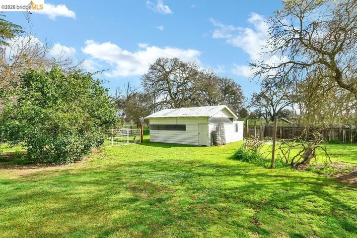 View of yard featuring an outdoor structure