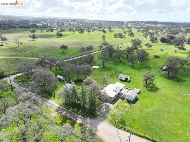 Overview of rural landscape with agricultural land and a tree filled landscape