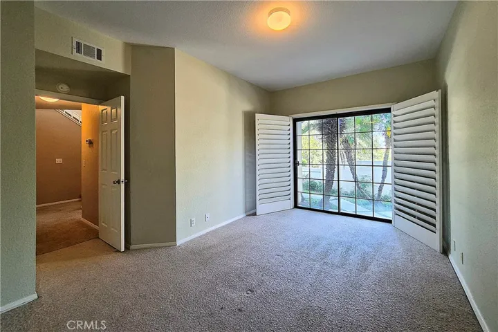 Guest Bedroom #1 on Entry Level, with access to Front Patio