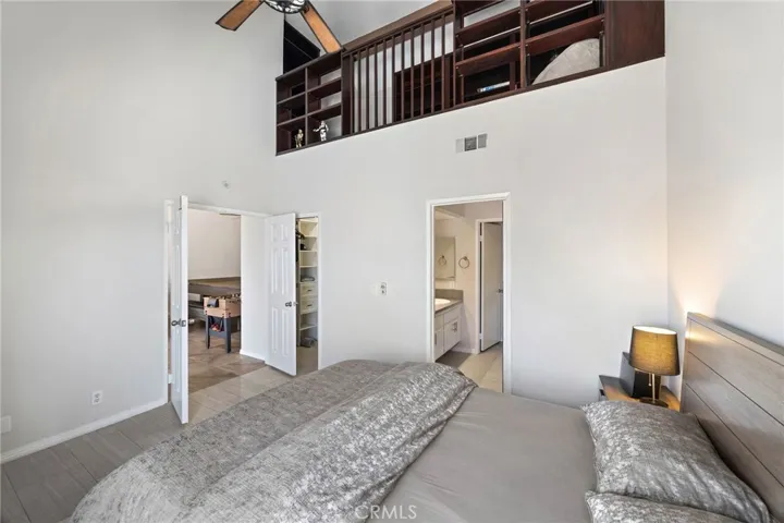 A loft above the primary bedroom is accessible from a pull down staircase