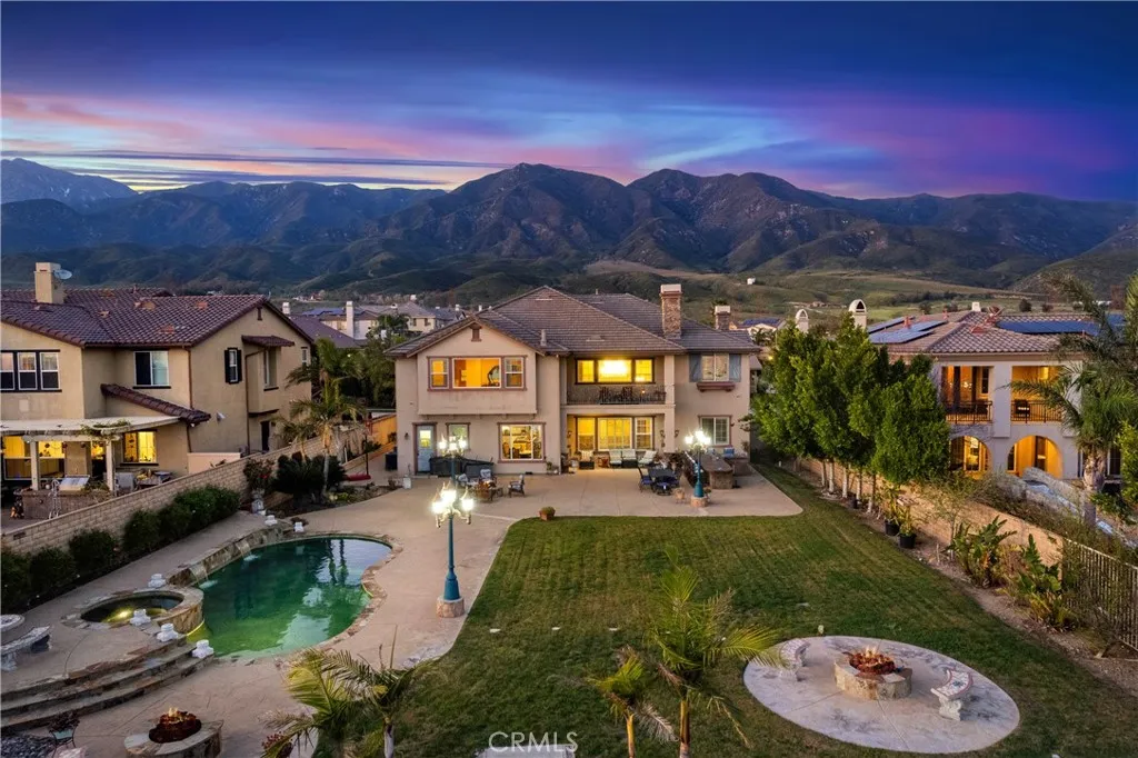 Panoramic city light, mountain & sunset views with resort style backyard and pool.