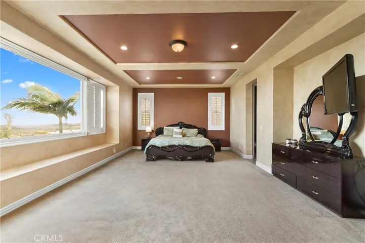 Primary bedroom with panoramic views.