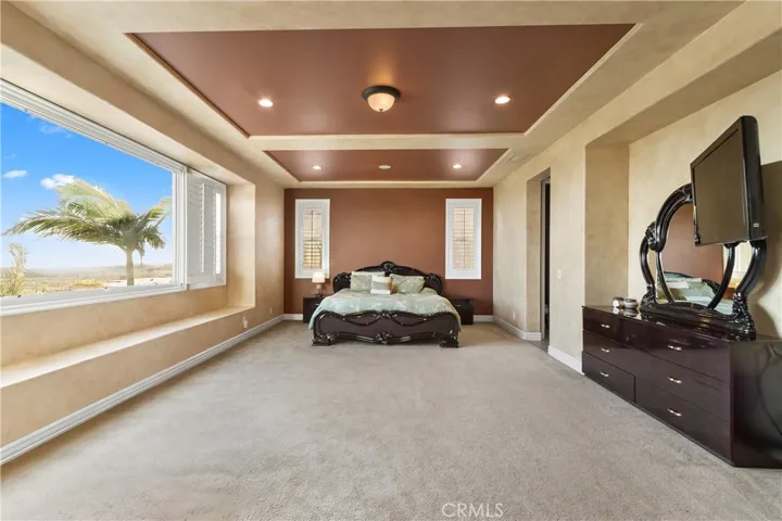Primary bedroom with panoramic views.