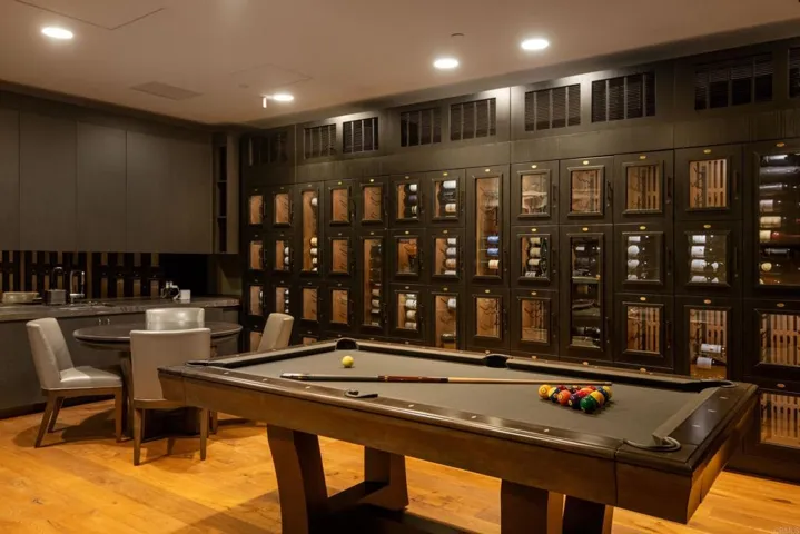 Wine room at The Park with wine storage lockers, billiards and poker table