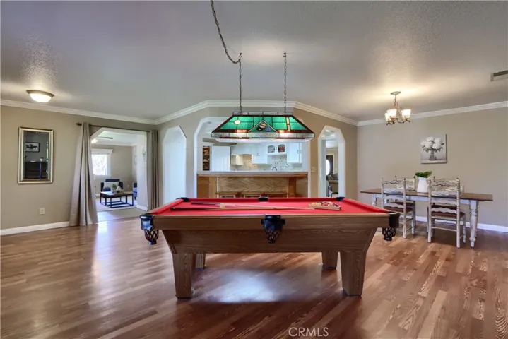 Game Room with Bar Stool Seating to Kitchen.