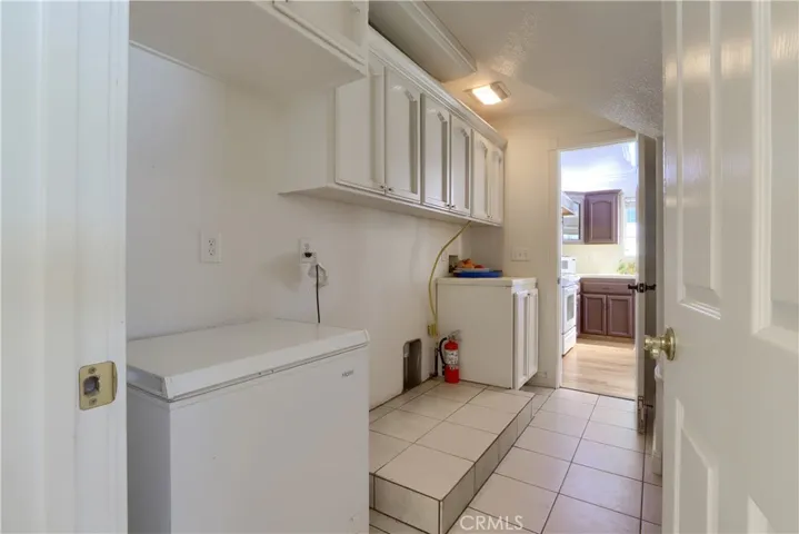 Large Laundry, Freezer area with tons of Storage.