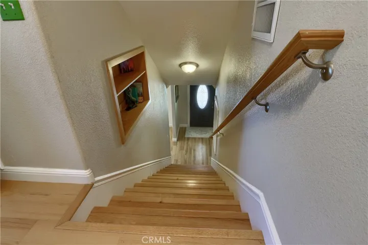 Staircase up from Home 1 to 3 Additional Rooms, 2 powder baths.