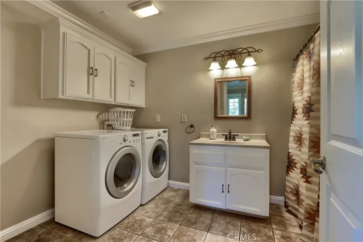 Laundry room with in-room bath