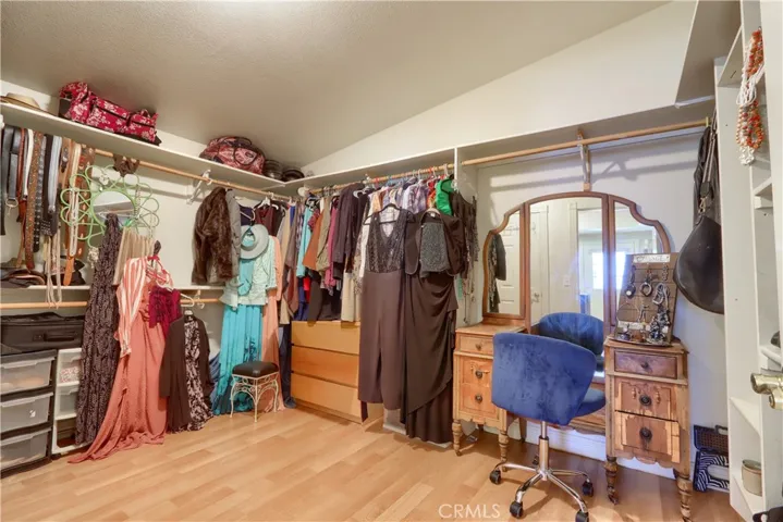 One of two walk-in closets in the primary bedroom
