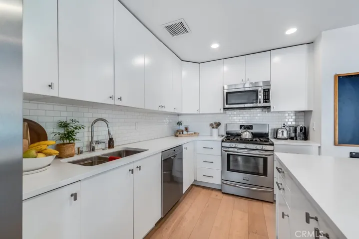 Kitchen with quartz counters and stainless steel appliances