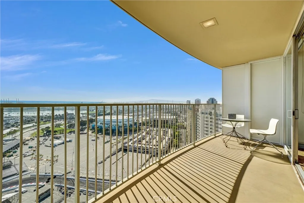 Spacious 31st-floor balcony, perfect for elegant entertaining or relaxing while taking in a romantic sunset.