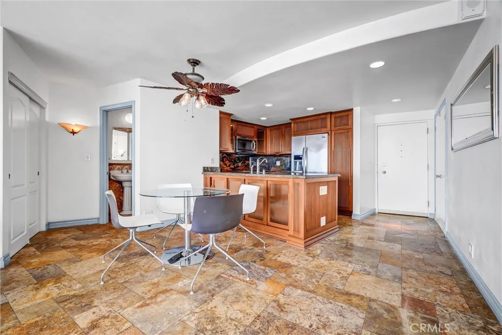 Dining area seamlessly positioned between the kitchen and living room for easy flow and entertaining.