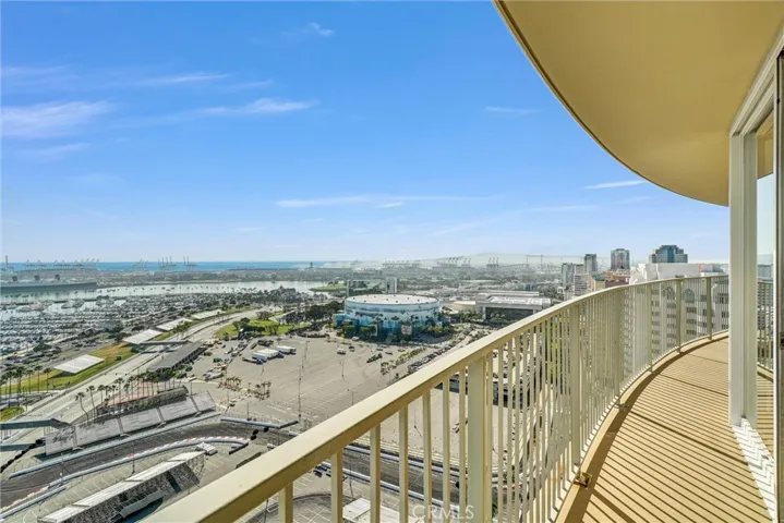 Expansive west-facing balcony showcasing breathtaking city lights at night, with views extending to San Pedro.
