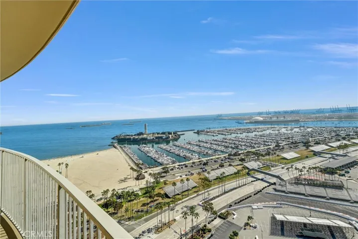 Southwest-facing balcony offering sweeping views of the upcoming Long Beach Grand Prix, Queen Mary, and the marina.