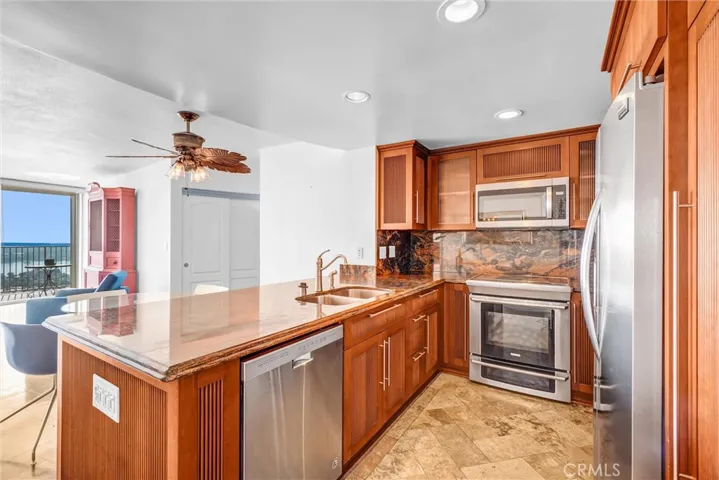 Kitchen featuring high-end cabinetry with a well-designed interior shelving system.