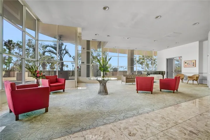 Elegant lobby featuring a grand piano and a serene atmosphere, ideal for relaxing and taking in the views.