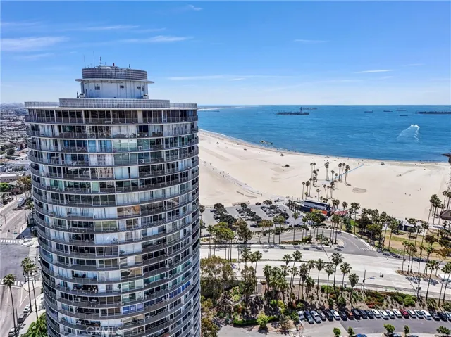 East-facing aerial view of 700 Ocean Tower with breathtaking views of the Pacific Ocean and nearby beaches.