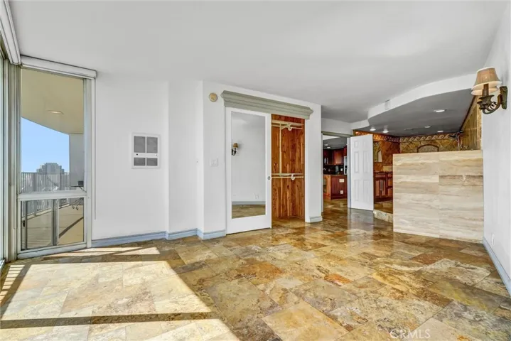 Tranquil bedroom with panoramic views to greet you each morning, enhanced by a custom pine-wood closet and a thoughtfully designed pet gate, allowing your companion to savor the morning breeze.