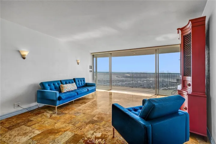 Southeast-facing living room offering stunning views of Queen Mary and Marina.