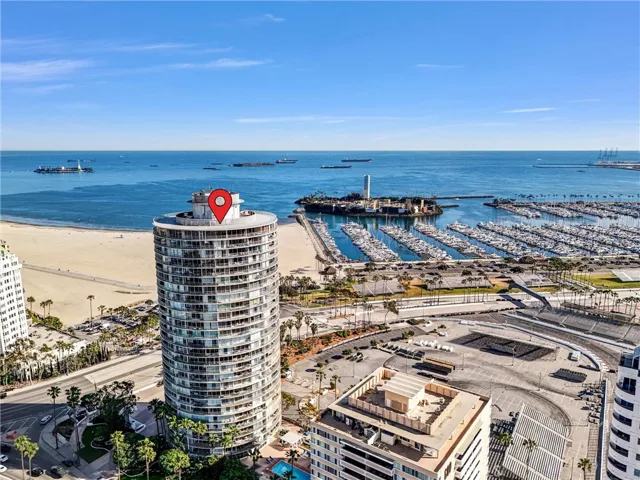 South-facing aerial view of the building and Shoreline Drive & Marina.