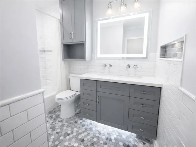 New vanity, lighting, fixtures, sink and double faucets with LED Mirror.