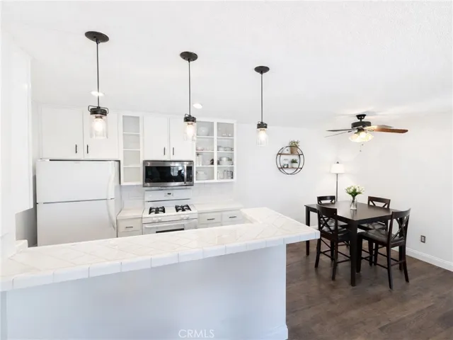 Bright, white kitchen with a clean, inviting design.