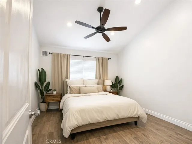 Large bedroom with vaulted ceiling.