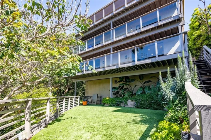 The home has plenty of outdoor living space with 3 decks, terraced yard and mature fruit trees.