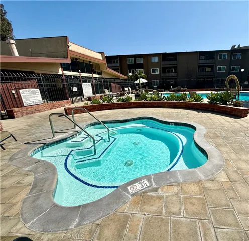 Spa with plenty of tables poolside