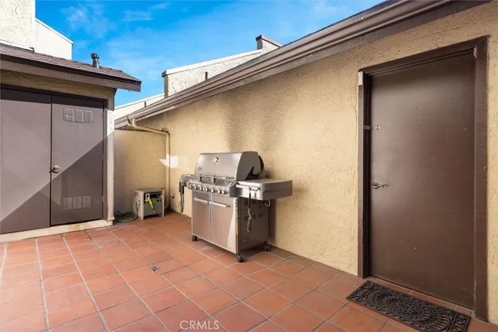 Tiled patio with room to relax + garage access