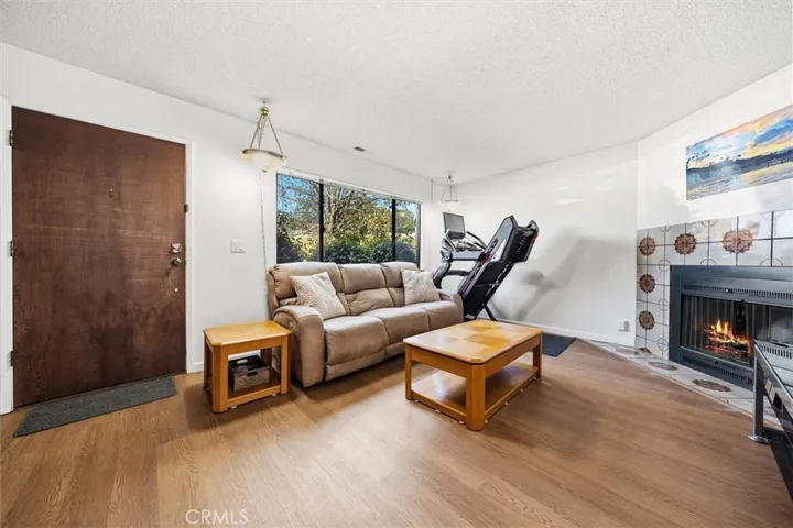 Enter into spacious living room fresh vinyl flooring