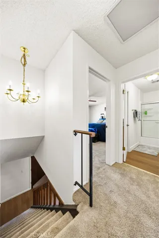 Upstairs landing leads to bedrooms + full bathroom