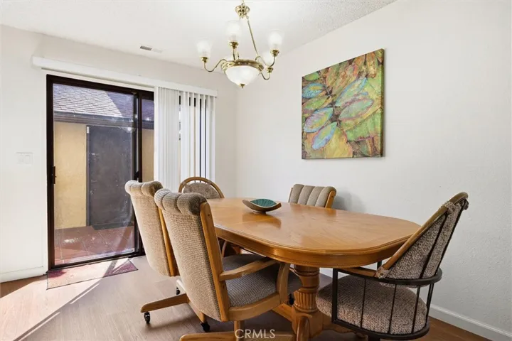 Slider door leads to patio off of dining area