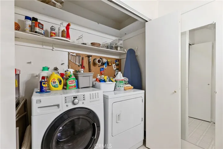 Washer Dryer area sliding with doors off powder room