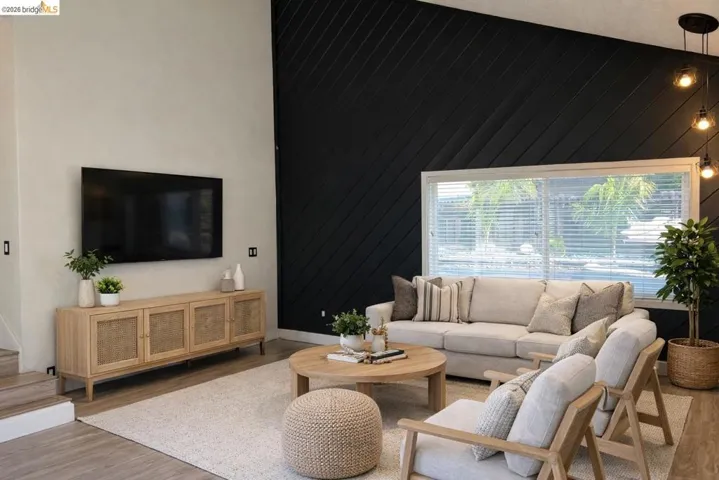 Living room featuring wood finished floors and wooden walls