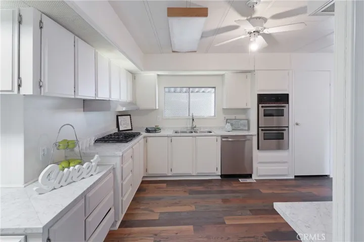 Kitchen With New Paint, Countertops and Flooring.