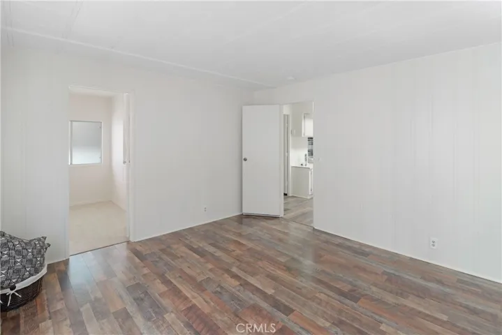 Primary Bedroom With New Paint and Flooring