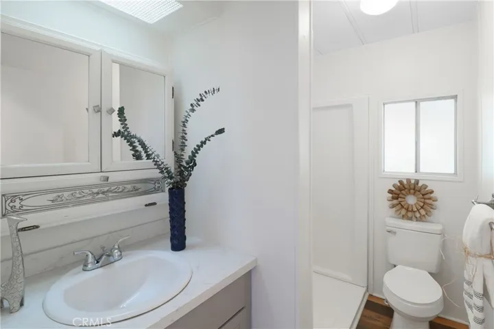 Guest Bathroom With New Paint, Flooring, Newer Shower and Vanity