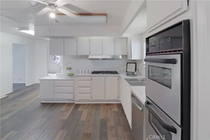Kitchen With New Paint, Countertops and Flooring.