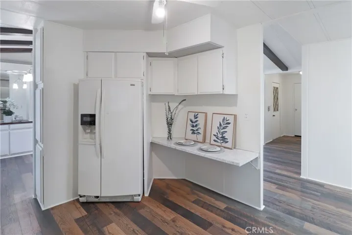 Kitchen With New Paint, Countertops and Flooring.